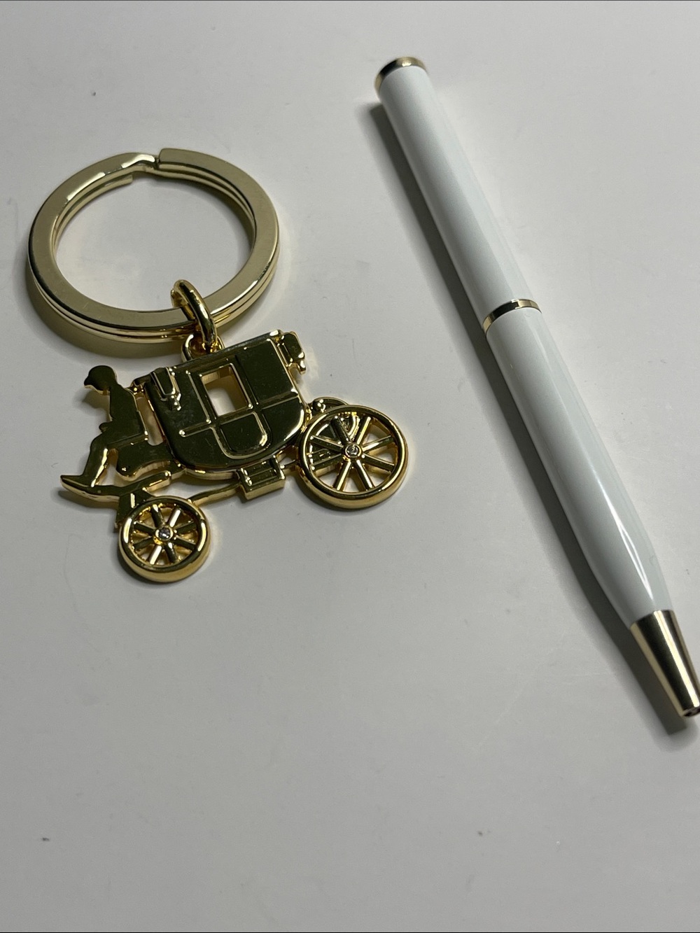 Coach Gold Carriage Keychain with a Coach White Pen